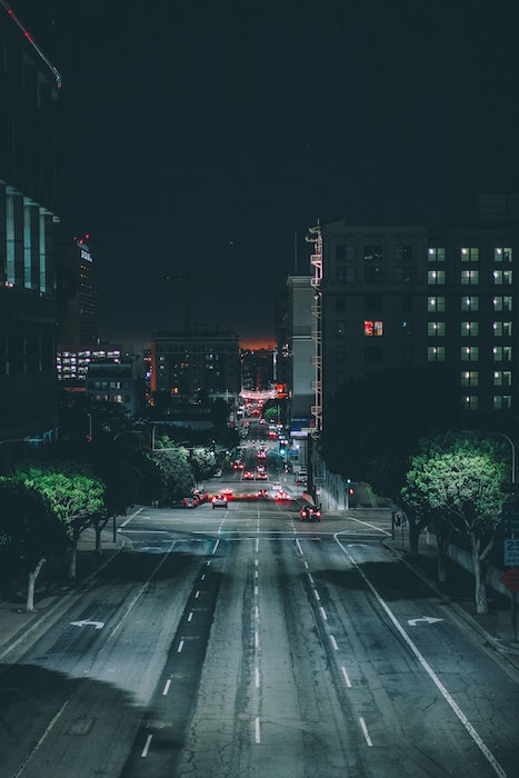 City street scene with cars in the distance shot at night time, shot with one of the best cameras for night photography