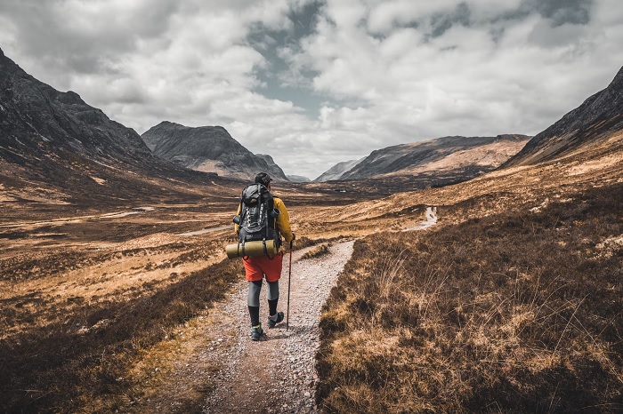 Hiker walking a mountain trail