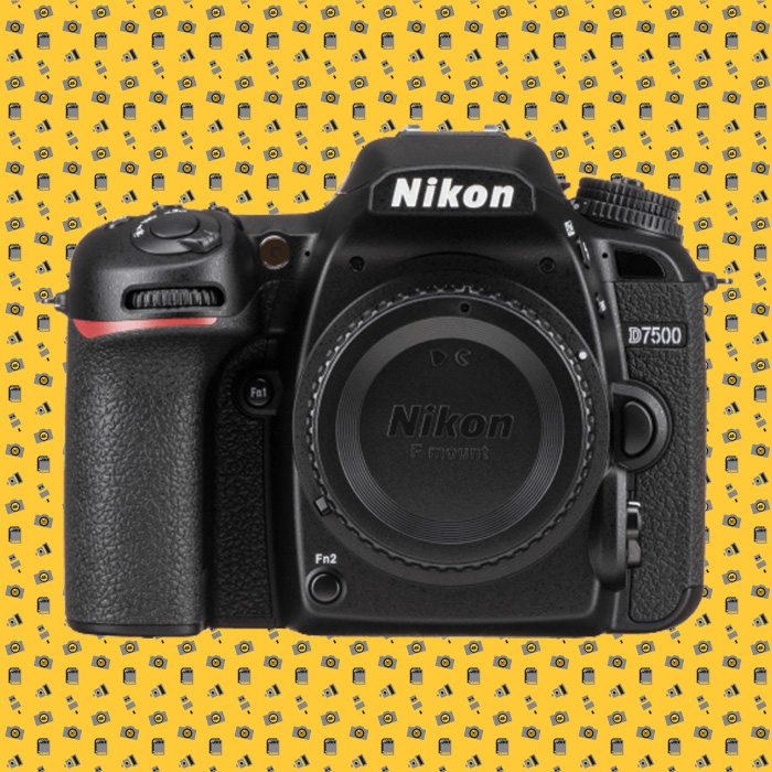 Our best camera for concert photography Nikon D7500 on funky yellow pattern background