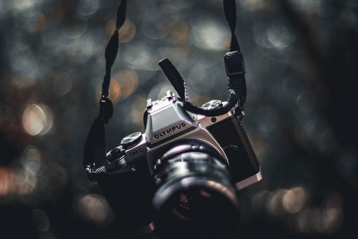 Ollympus OMD best micro four thirds camera hanging with bokeh