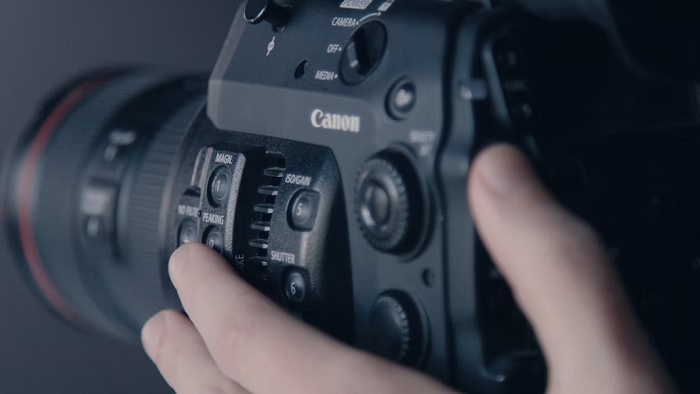 Close up of hand using a Canon camera