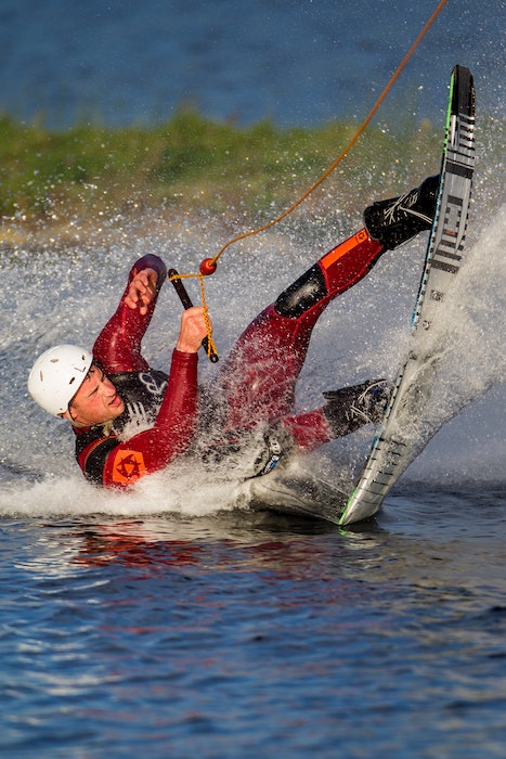 An sports action photo of a waterboard skier trying to keep balance