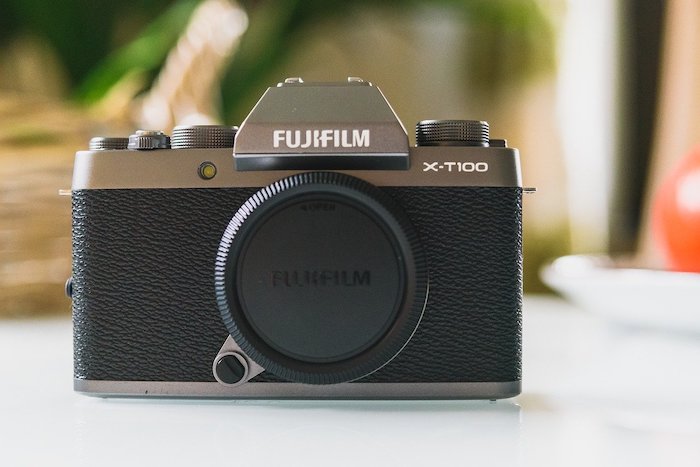 Fujifilm X-T100 camera body on a table