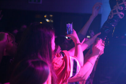 Mobile phone taking video at a concert