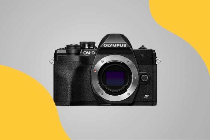 Best Camera for Sports Moms (Olympus OM-D E‑M10 Mark IV) on colored backround