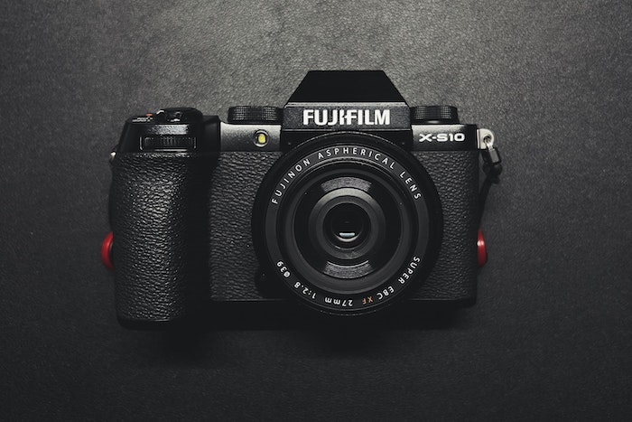 Flat lay image of Fuji X-S10 - our best mirrorless camera under 00