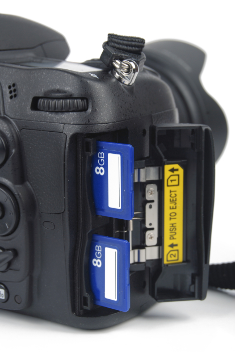 Stock photo of a DSLR camera with two memory card slots
