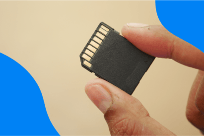 Holding a camera memory card between two fingers