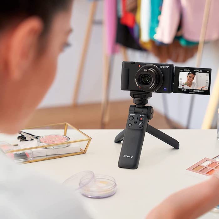 Sony ZV-1 compact camera being used on a desk by a beauty and makeup vlogger