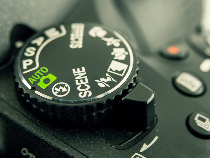 Close-up image of DSLR camera mode dial for aperture, shutter speed, iso