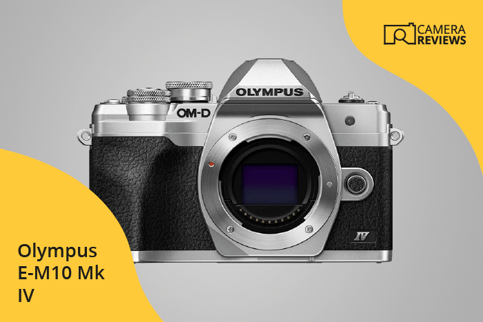Olympus OM-D E-M10 Mark IV photographed on a colored background