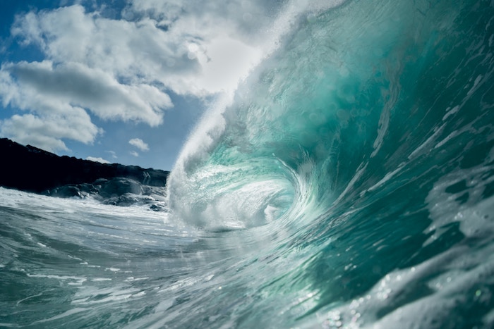 A large ocean wave shot with a fish-eye lens