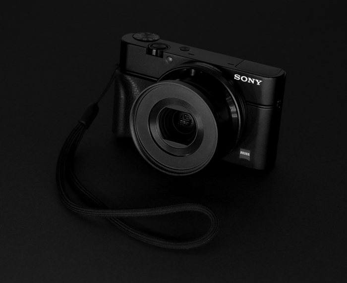  a sony compact camera with a black background