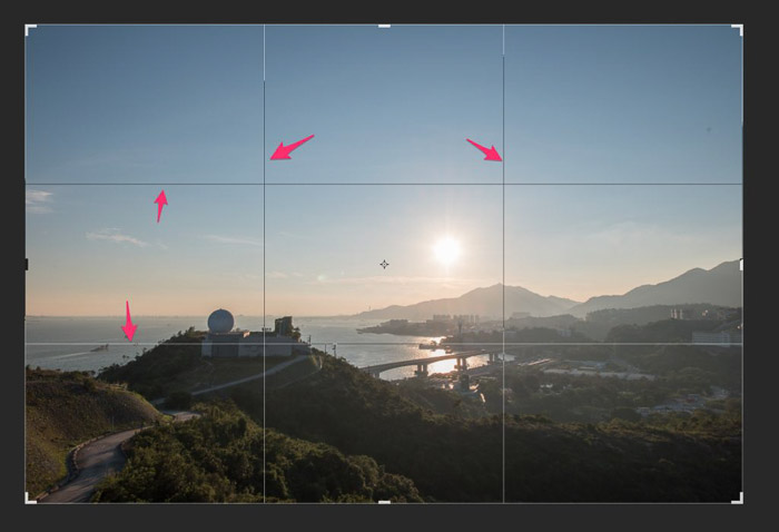 A screenshot of cropping in photography according to the rule of thirds with arrows pointing to lines